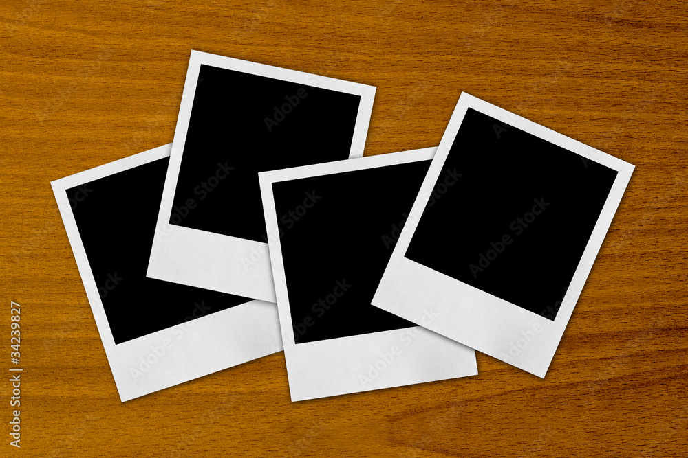blank photo frames on a wood background blank photo frames on a wood background