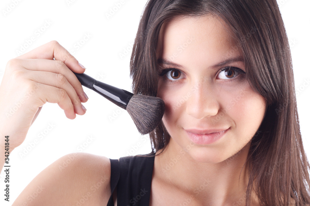 Beautiful woman with a make-up brush. Isolated Beautiful woman with a make-up brush. Isolated