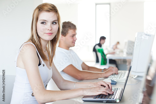 two college students using a computer