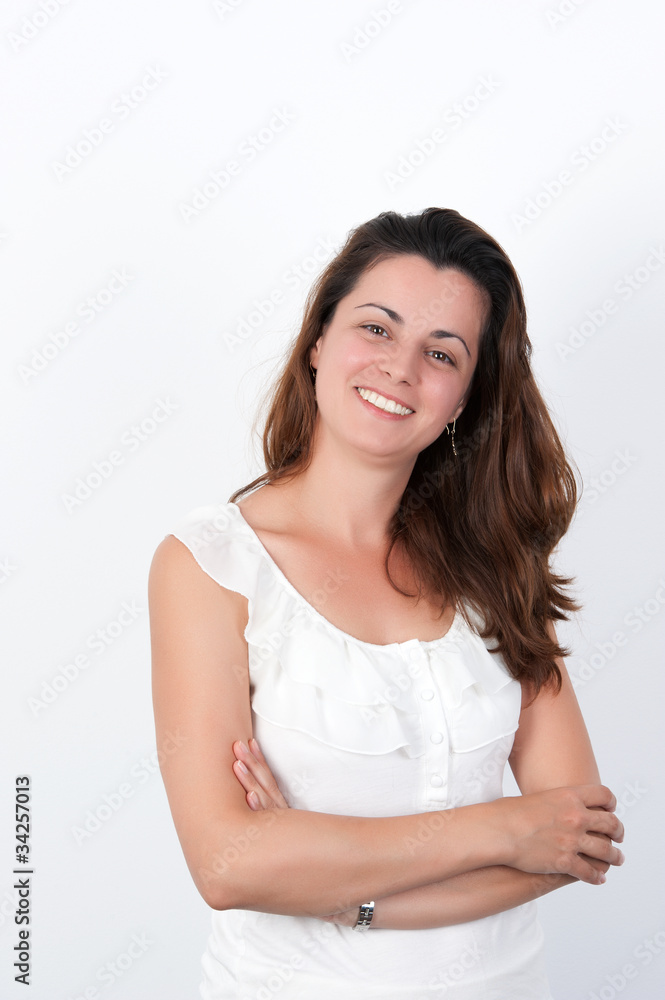 Portrait of young woman standing with hands folded Portrait of young woman standing with hands folded