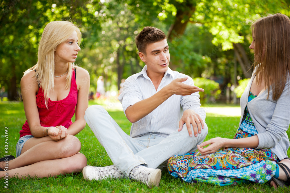 Portrait of three young teenagers laughing and having fun togeth Portrait of three young teenagers laughing and having fun togeth