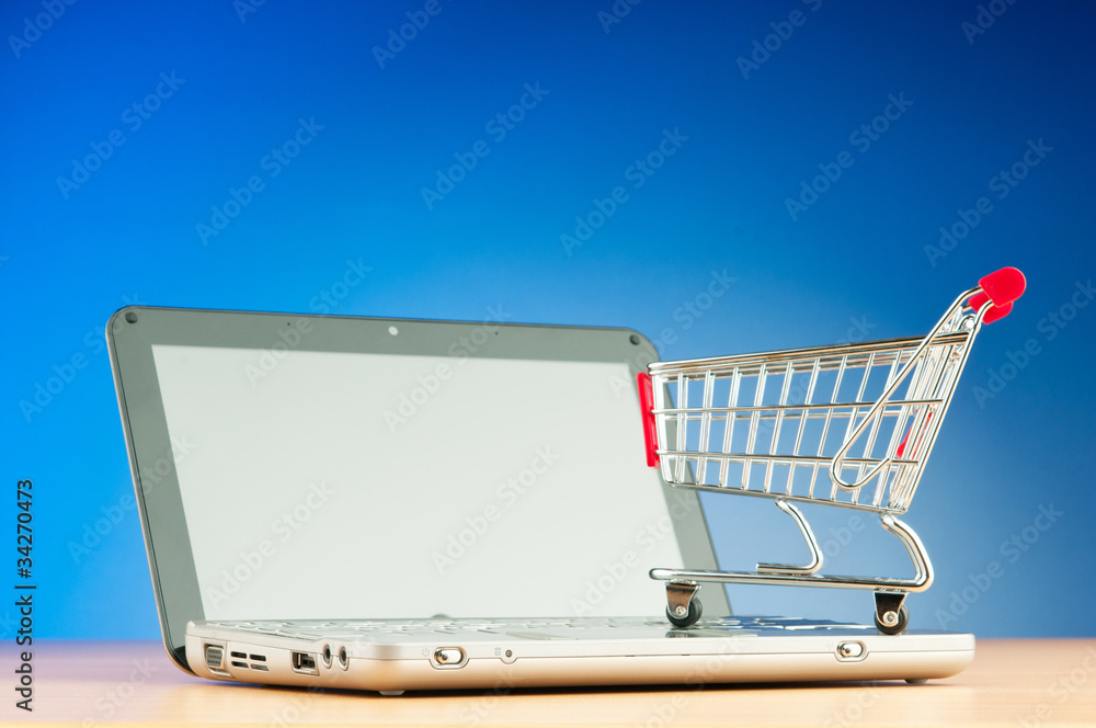 Internet online shopping concept with computer and cart Internet online shopping concept with computer and cart