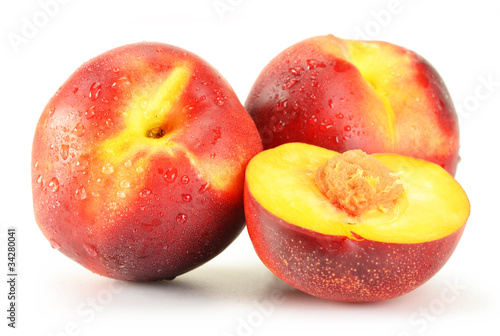 Peaches with visible drops of water isolated on white background