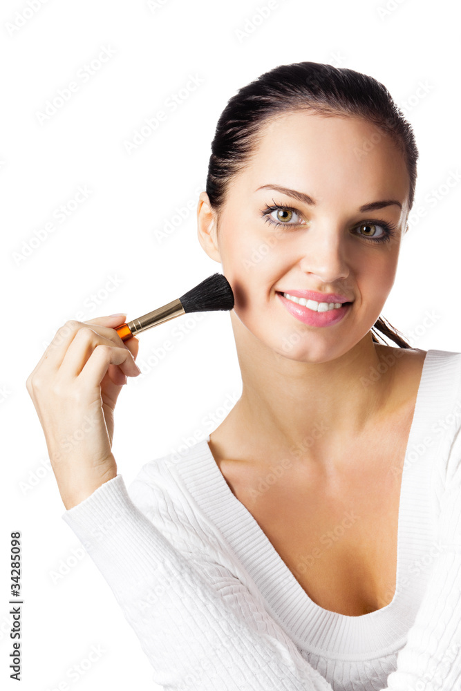 Young happy smiling woman with cosmetics brush, isolated Young happy smiling woman with cosmetics brush, isolated