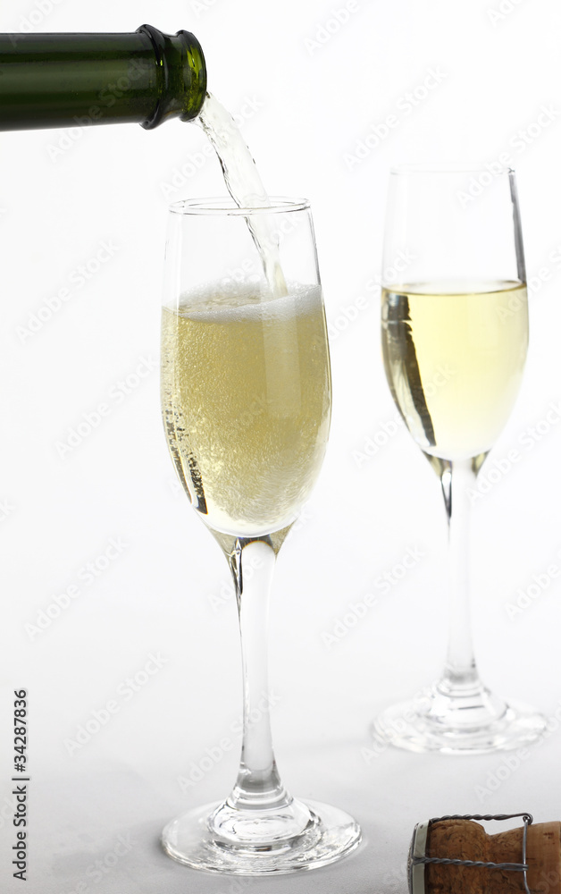 Champagne being poured into a champagne flute Champagne being poured into a champagne flute