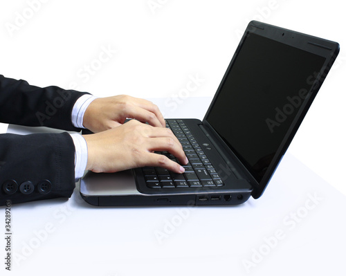 hands on the laptop keyboard