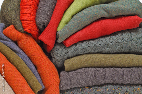 Stack of natural wool knitwear photo