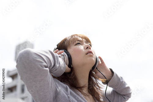 Asian woman in headphone © one