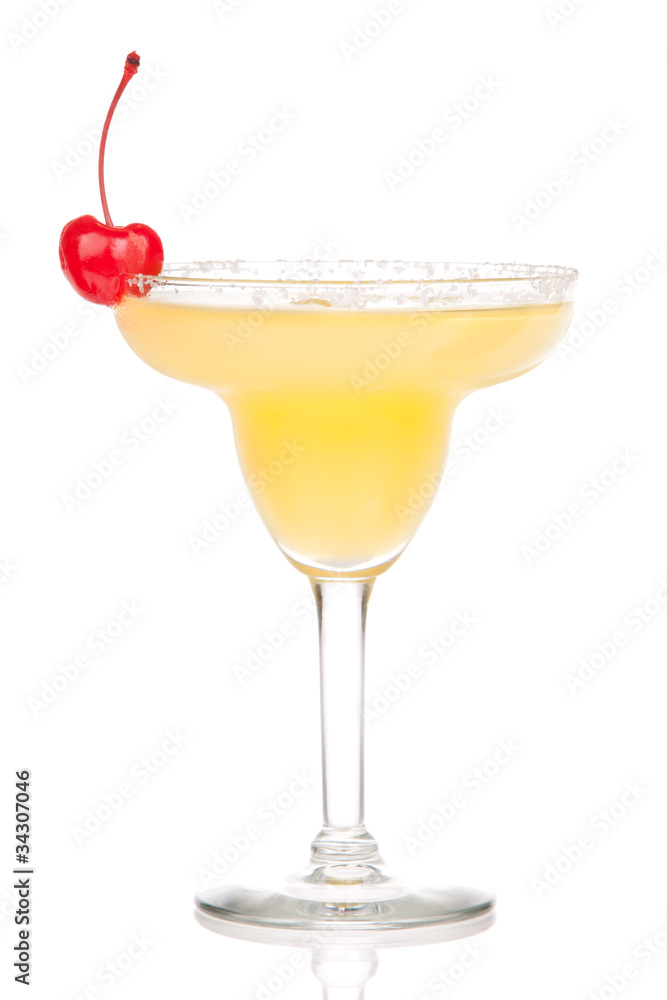 Yellow margarita cocktail with red cherry in chilled salt rimmed Yellow margarita cocktail with red cherry in chilled salt rimmed