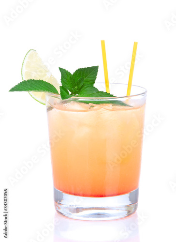 Alcohol tequila sunrise cocktail with crushed ice, green mint