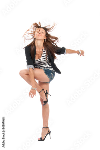 beautiful brunette woman dancing in casual cloth