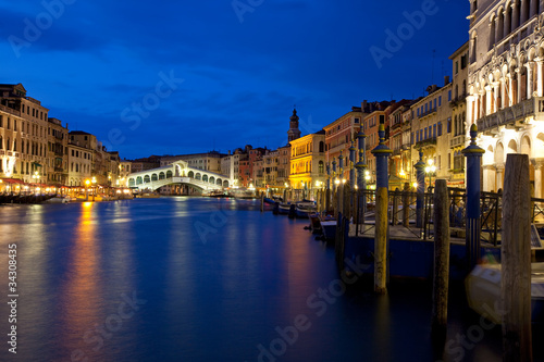 Venice at night on the Canal Grande with view of Rialto bridge