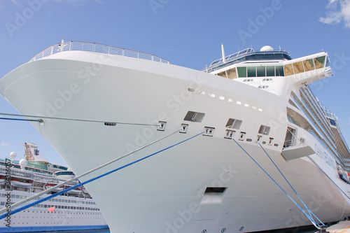 Bow of Luxury Cruise Ship Tied with Blue and White Ropes © dbvirago