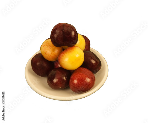 Two kinds of Cherries on a round dish