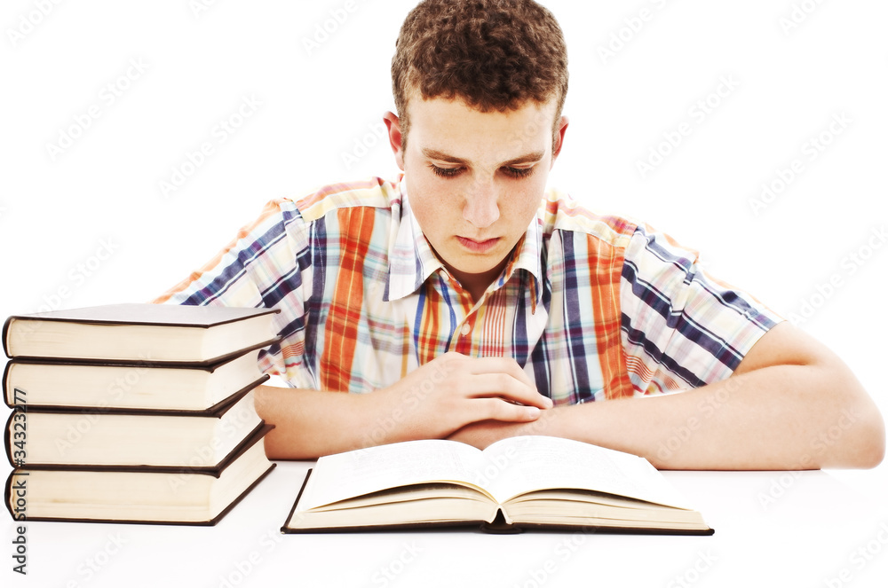 The young student with the books isolated on a white The young student with the books isolated on a white