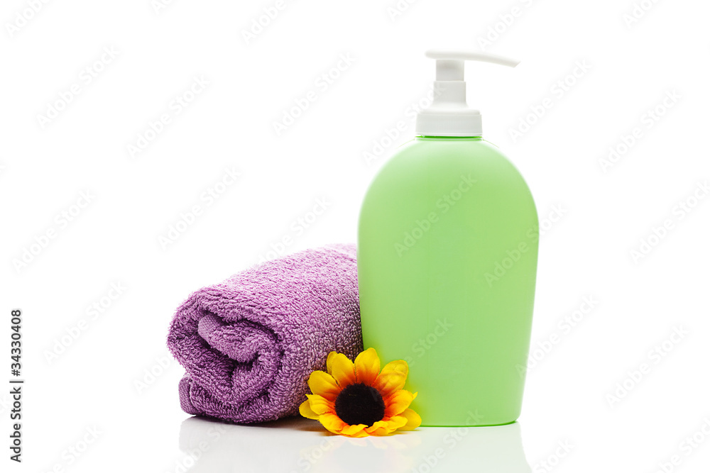 cosmetic containers, towel and flower isolated on white cosmetic containers, towel and flower isolated on white