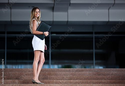 Young attractive businesswoman with a notebook