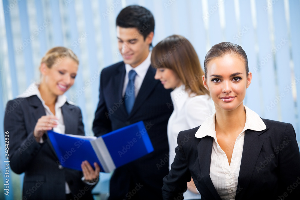 Portrait of happy smiling businesswoman and colleagues Portrait of happy smiling businesswoman and colleagues