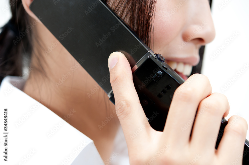 a woman talking by cellphone a woman talking by cellphone