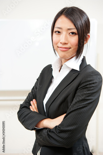 asian businesswoman with blank whiteboard