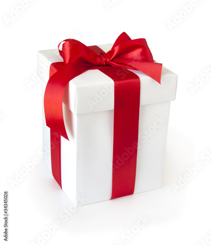 white gift box with red ribbon isolated on white