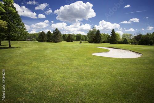 Bunker on golf course and cloudy sky