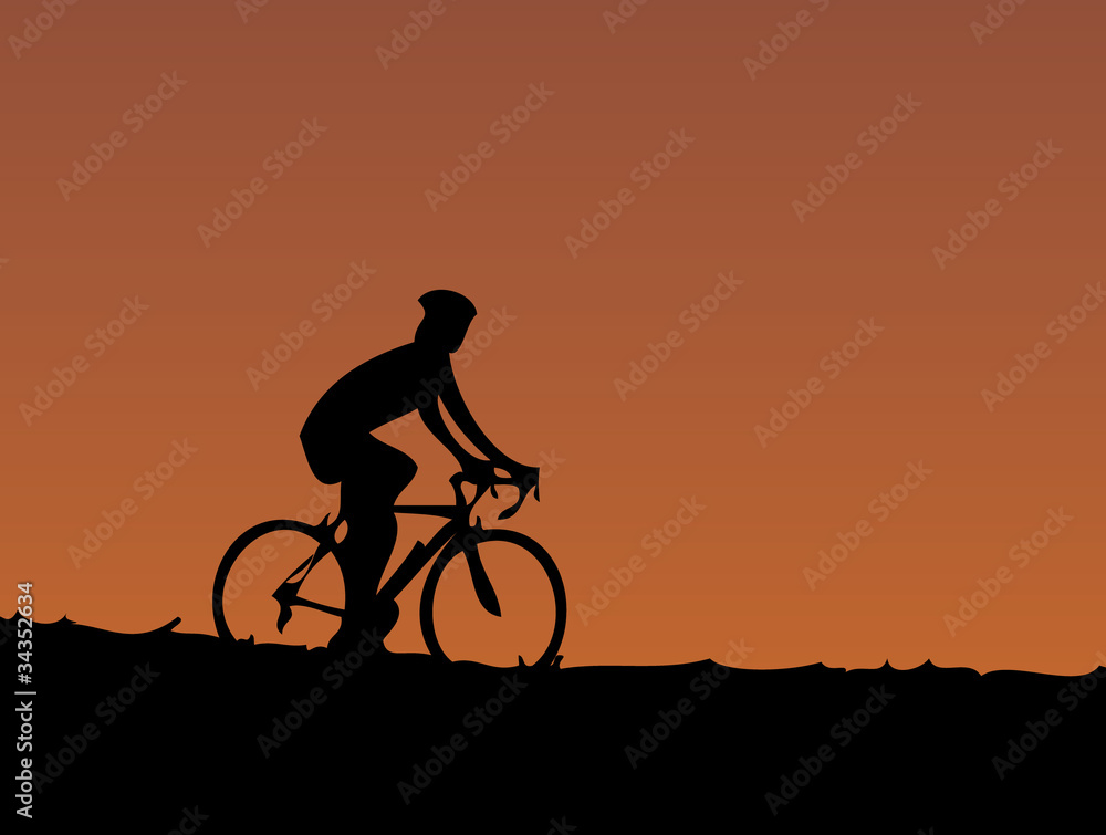 Obraz premium cyclist at sunset