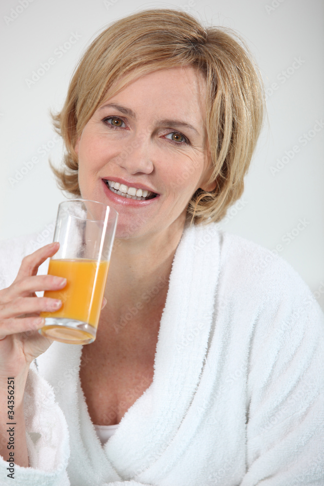 Woman drinking orange juice