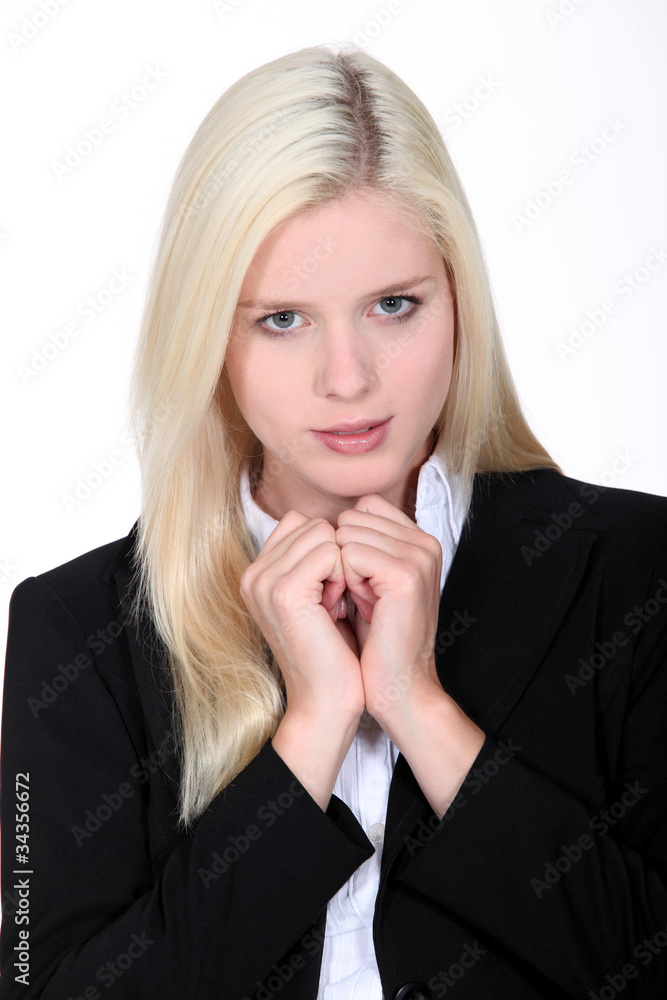 Blond business woman awaiting result of interview Blond business woman awaiting result of interview