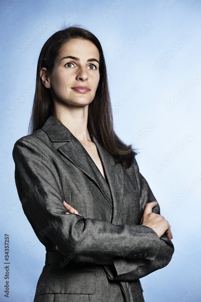 Portrait of confident business woman looking up-right. Portrait of confident business woman looking up-right.