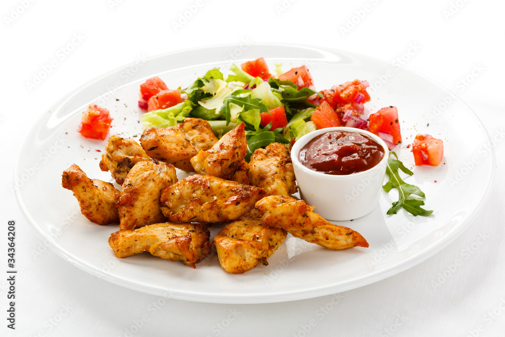 Fototapeta premium Grilled chicken nuggets and vegetables