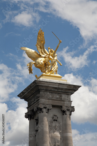 Paris - statue in gold from Alexandre III bridge