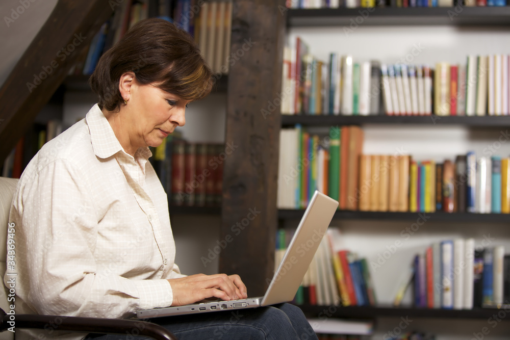 Attractive senior woman working on laptop Attractive senior woman working on laptop