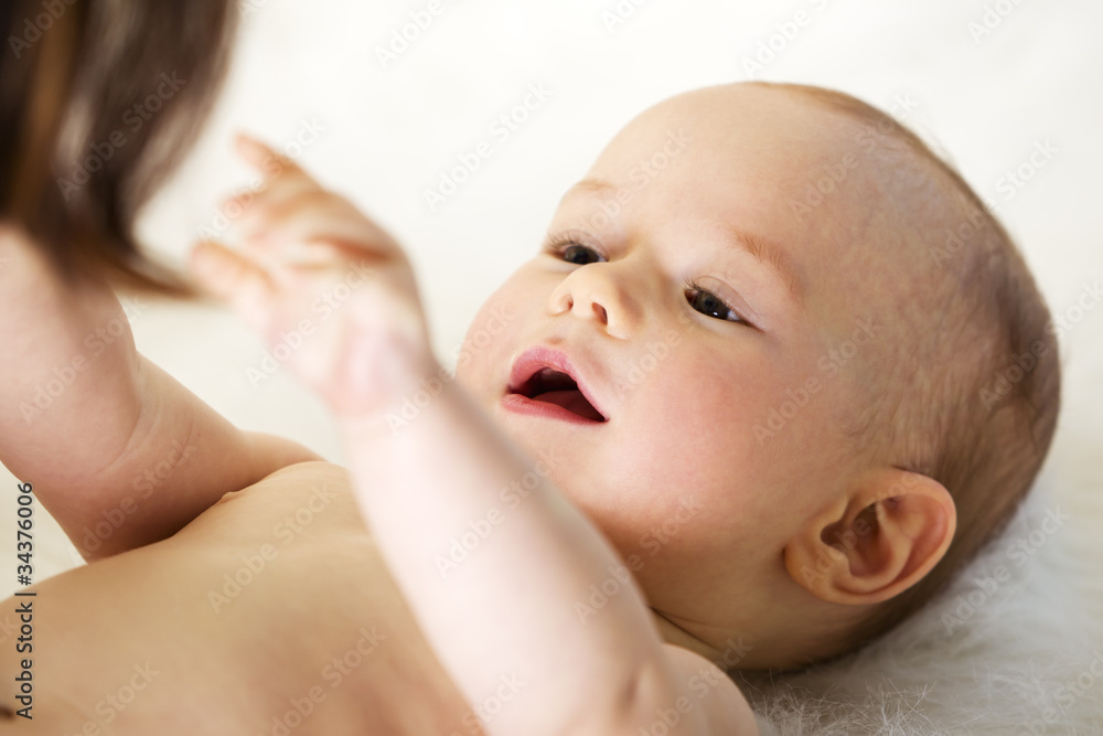 Caucasian baby reaching out for mother. Caucasian baby reaching out for mother.