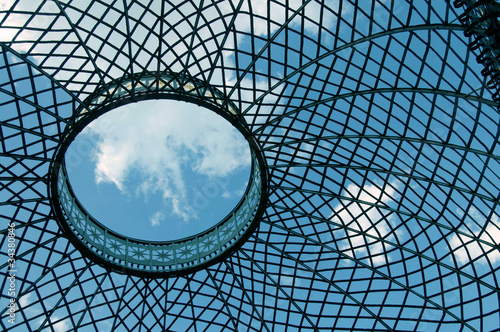 Wallpaper Mural Lattice dome on the background of sky and clouds.