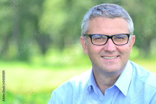 portrait of a man with glasses
