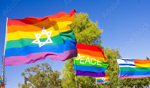Rainbow flags with national symbols and the word PEACE.