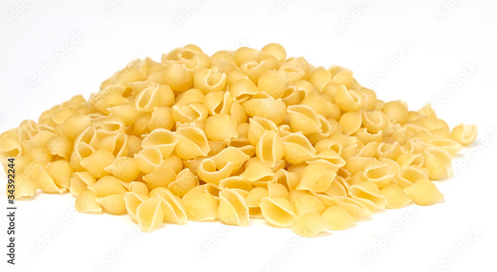 close up of a dried italian pasta on white background close up of a dried italian pasta on white background