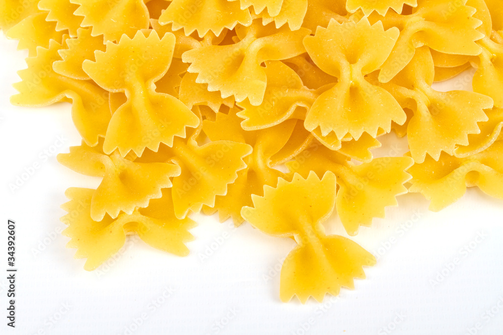 close up of a dried italian pasta on white background close up of a dried italian pasta on white background