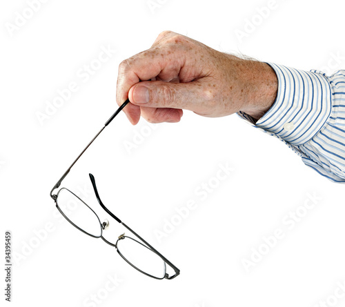 Glasses aka spectacles in hand - studio isolated over white
