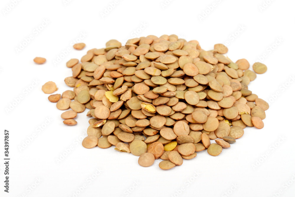 Pile of green lentils from low perspective isolated on white. Pile of green lentils from low perspective isolated on white.