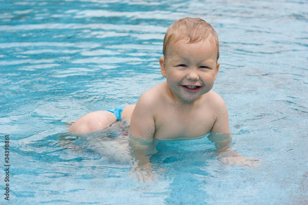 Little boy in a swimming pool