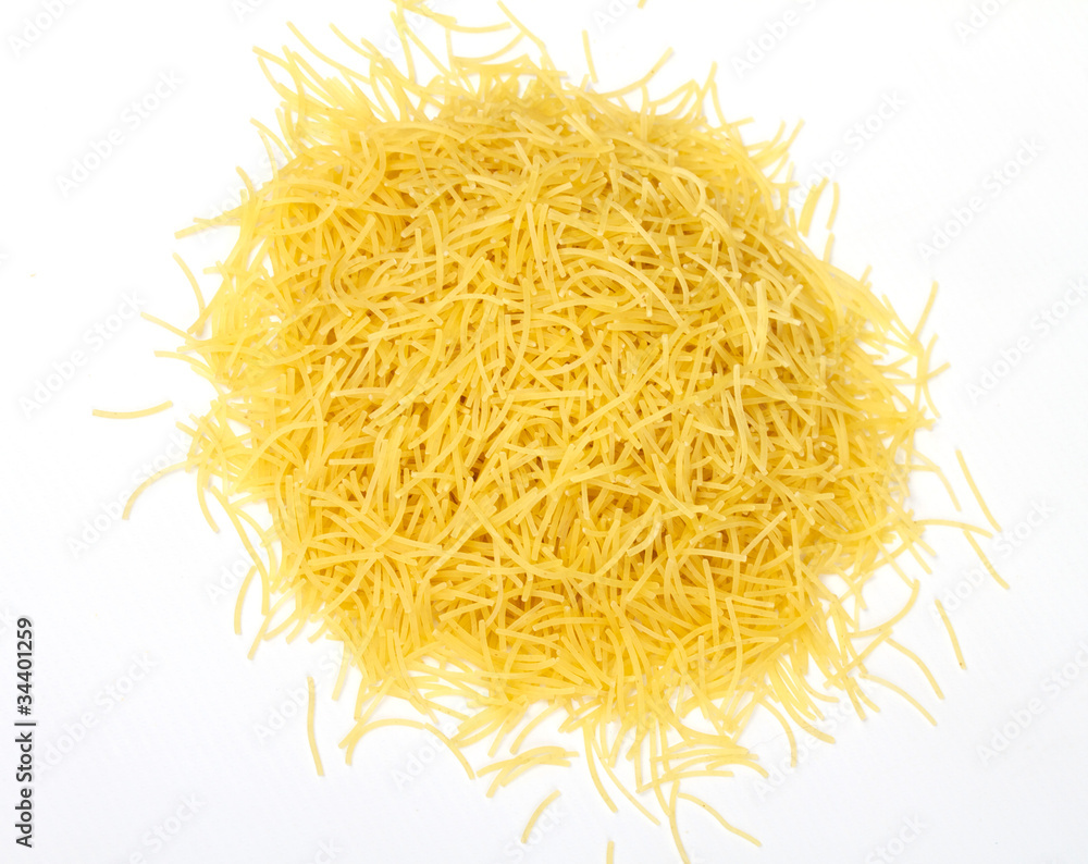 close up of a dried italian pasta on white background close up of a dried italian pasta on white background