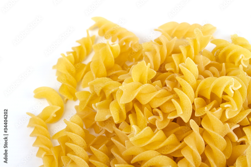 close up of a dried italian pasta on white background close up of a dried italian pasta on white background