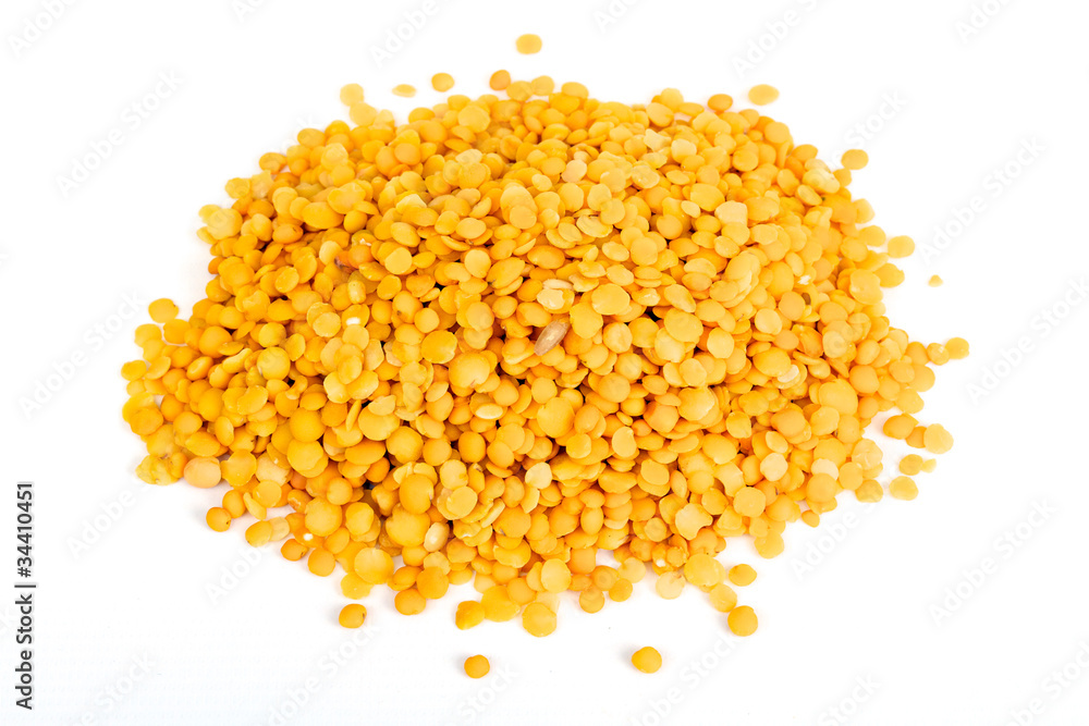 Yellow lentils isolated on white background.Macro shot.