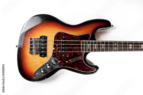 an isolated vintage electric bass guitar