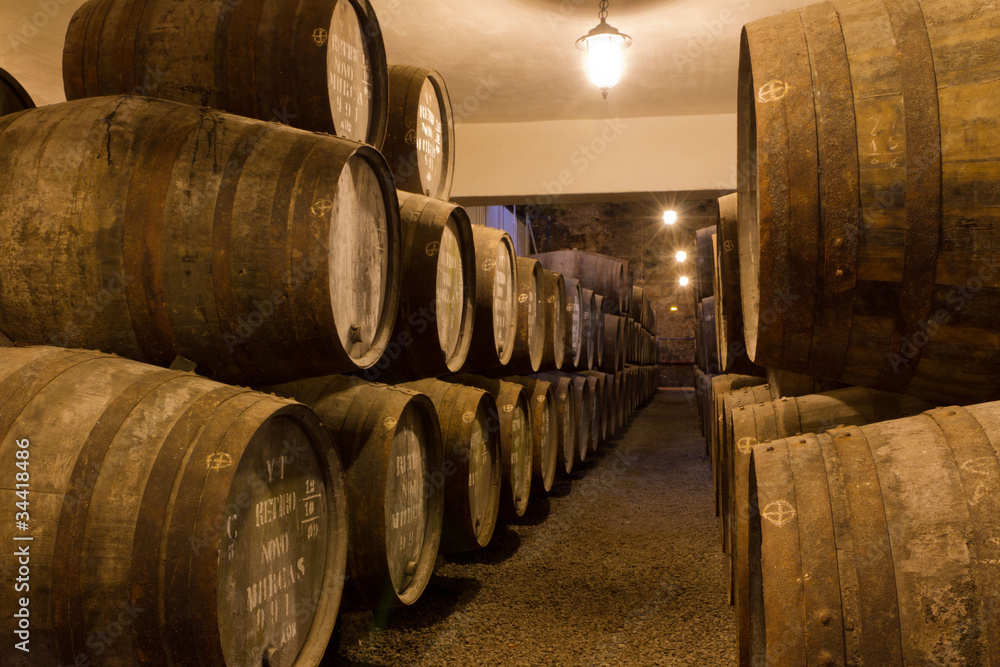 port wine ages in barrels in cellar