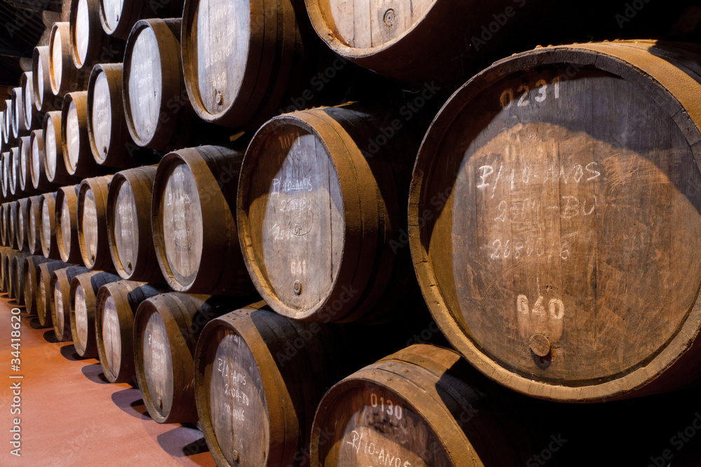 port wine ages in barrels in cellar