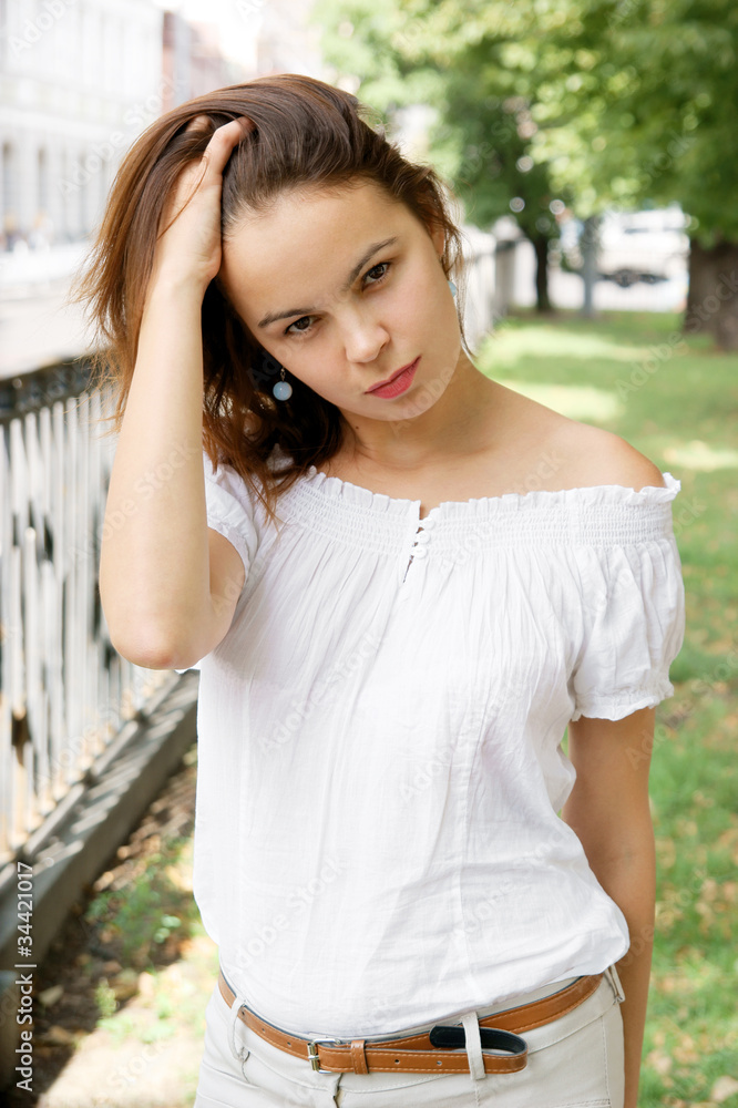 Pretty woman in summer dress in big city Pretty woman in summer dress in big city