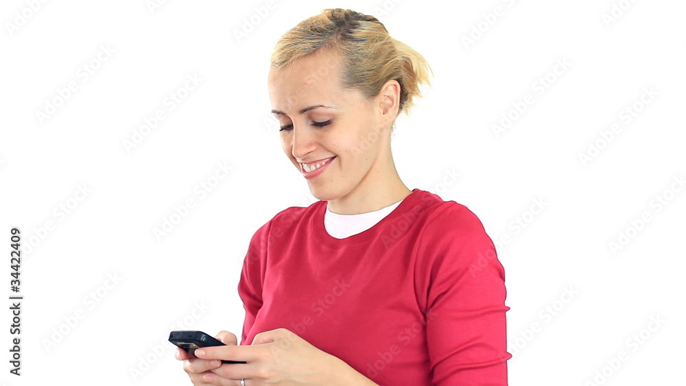 Attractive happy woman texting, sending sms and smiling Attractive happy woman texting, sending sms and smiling